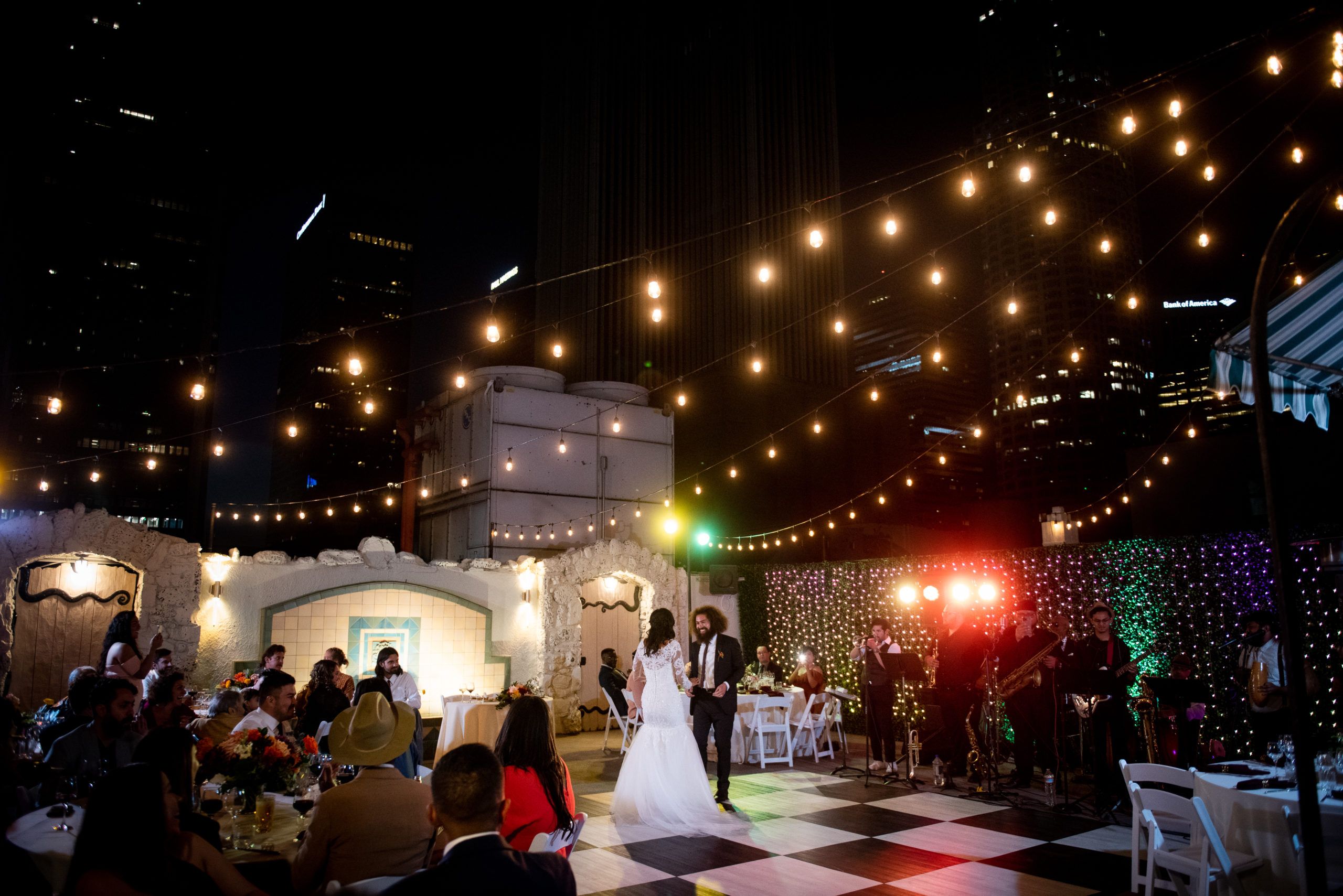 Stunning Wedding at The Oviatt Penthouse in Los Angeles, California at night with black and white dance floor | PartySlate
