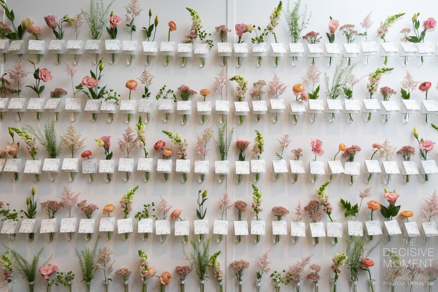 Garden-style wedding seating chart with vase and blooms | PartySlate