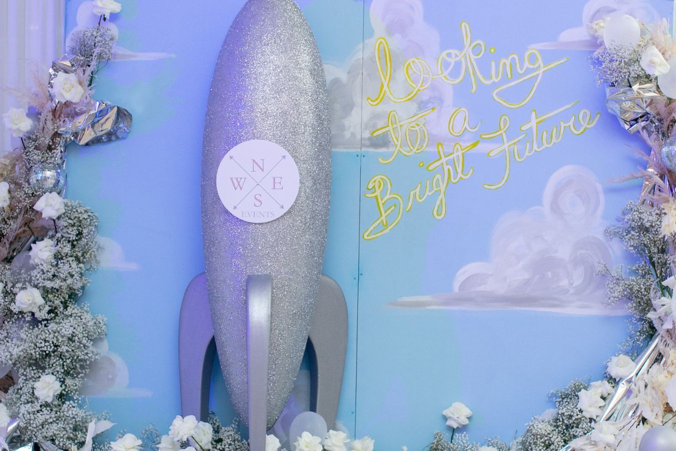 Space backdrop with inspiring message for business anniversary | PartySlate