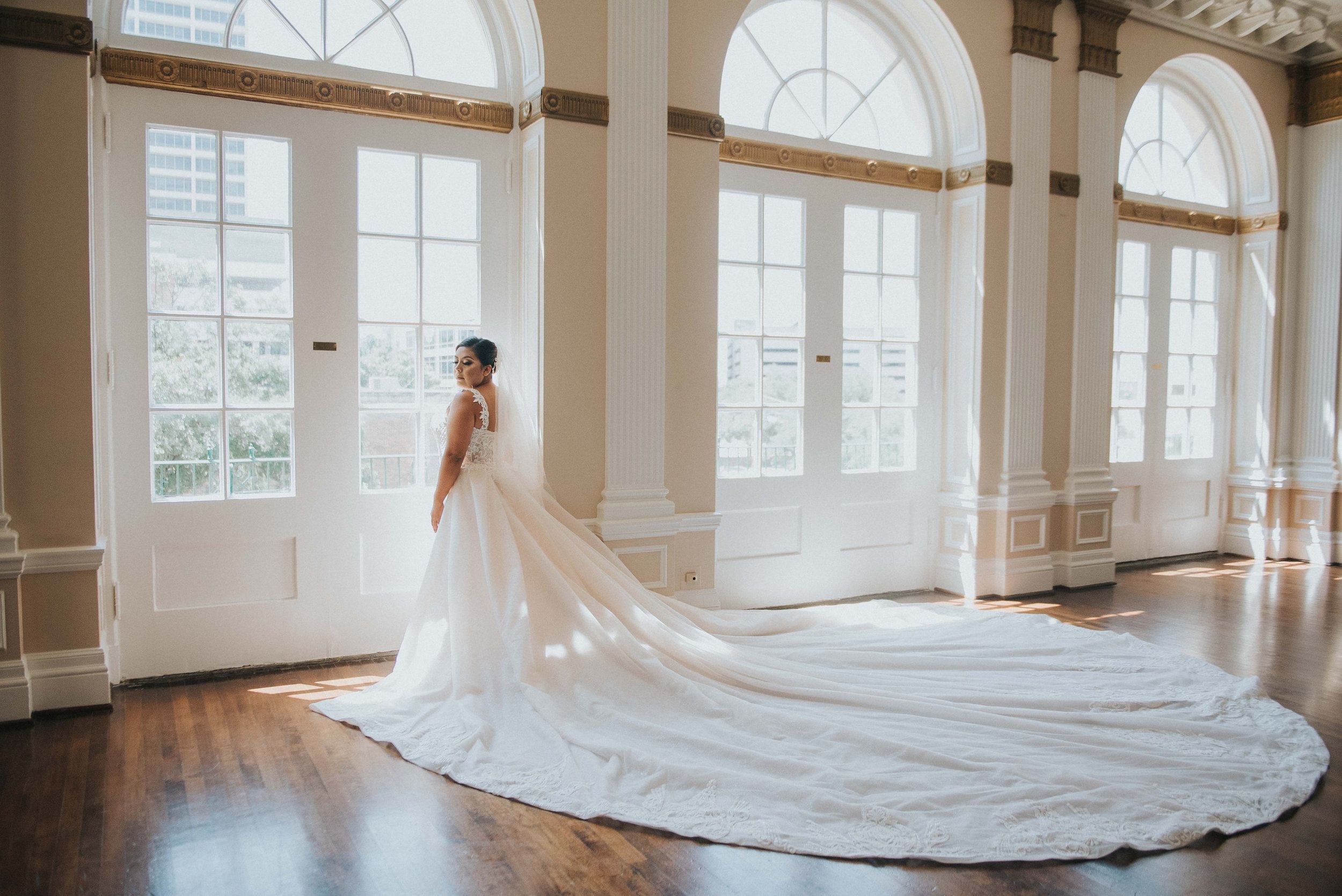 wedding at Historic 512 Downtown Fort Worth with bridal posing in her white wedding dress | PartySlate
