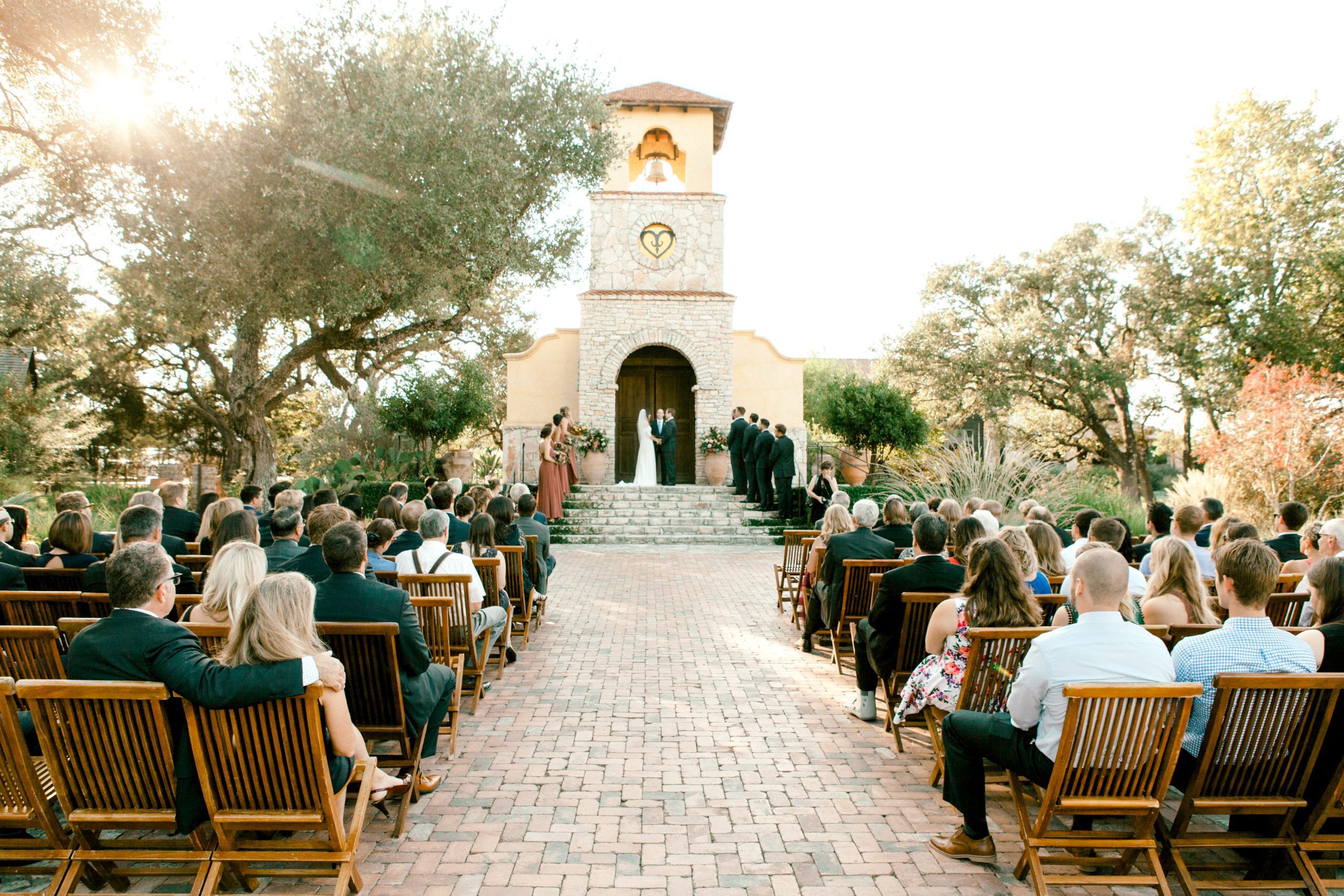 chic outdoor wedding at dripping springs wedding venue Camp Lucy | PartySlate
