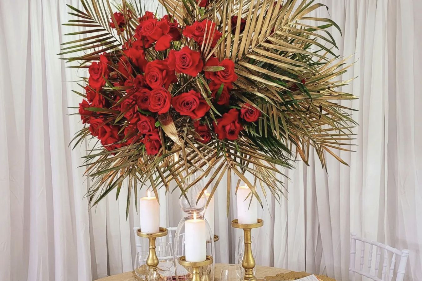 Gold palm leaf and rose tall wedding centerpiece | PartySlate