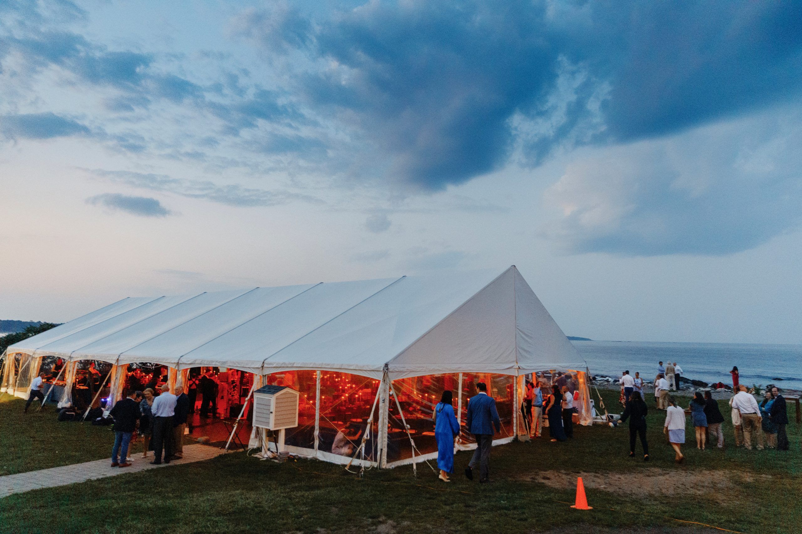 Tent wedding at Dusk by Hailey and Joel Photogrphy at Seacoast Science Center in Rye, New Hampshire | PartySlate