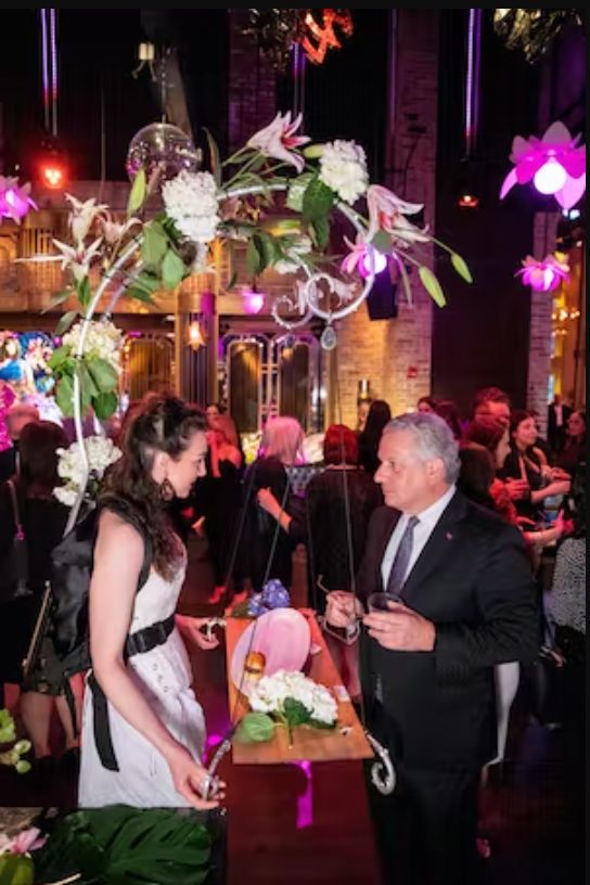 A floating tray for food and drink at a party.