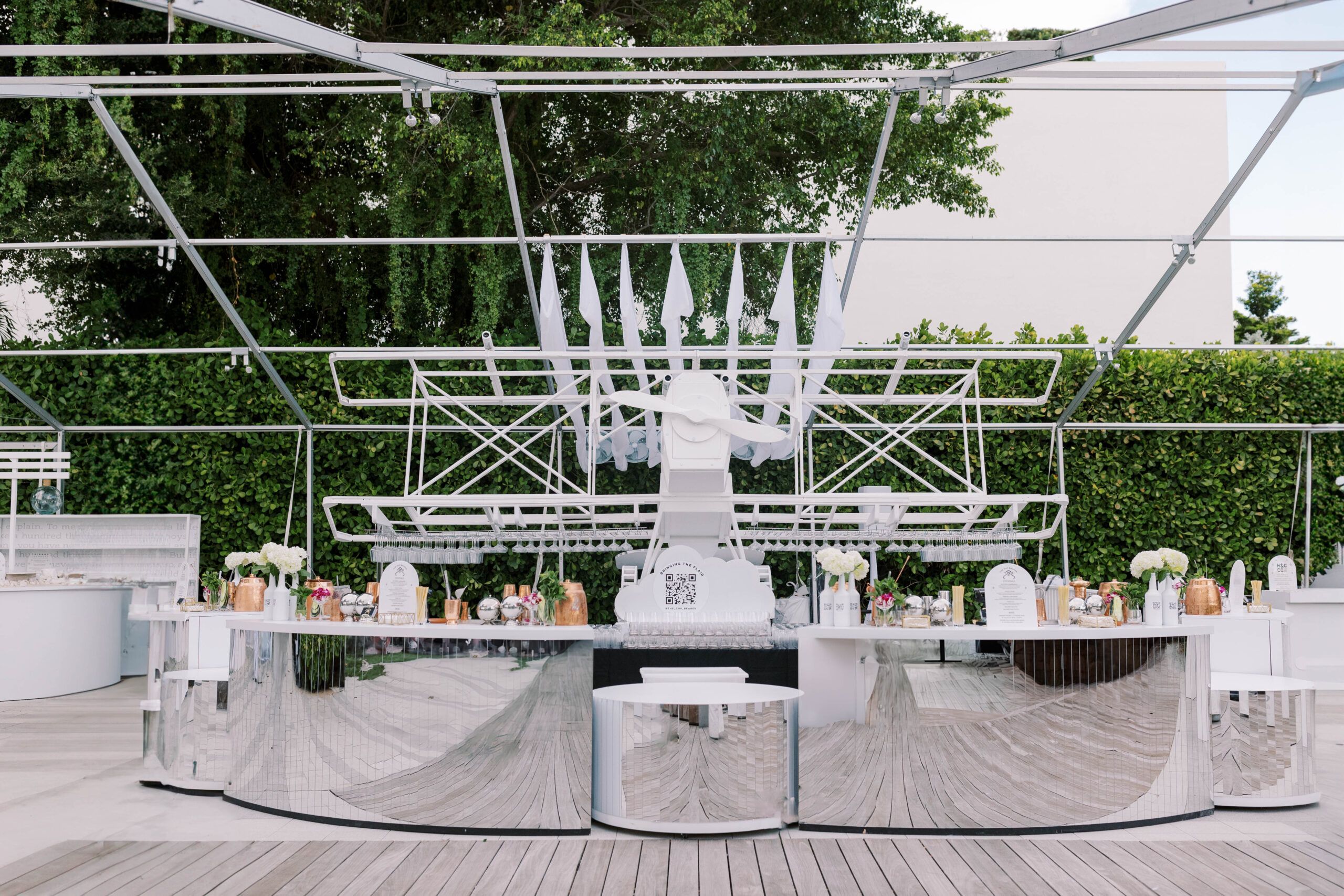 Metallic and mirrored bar with a white airplane