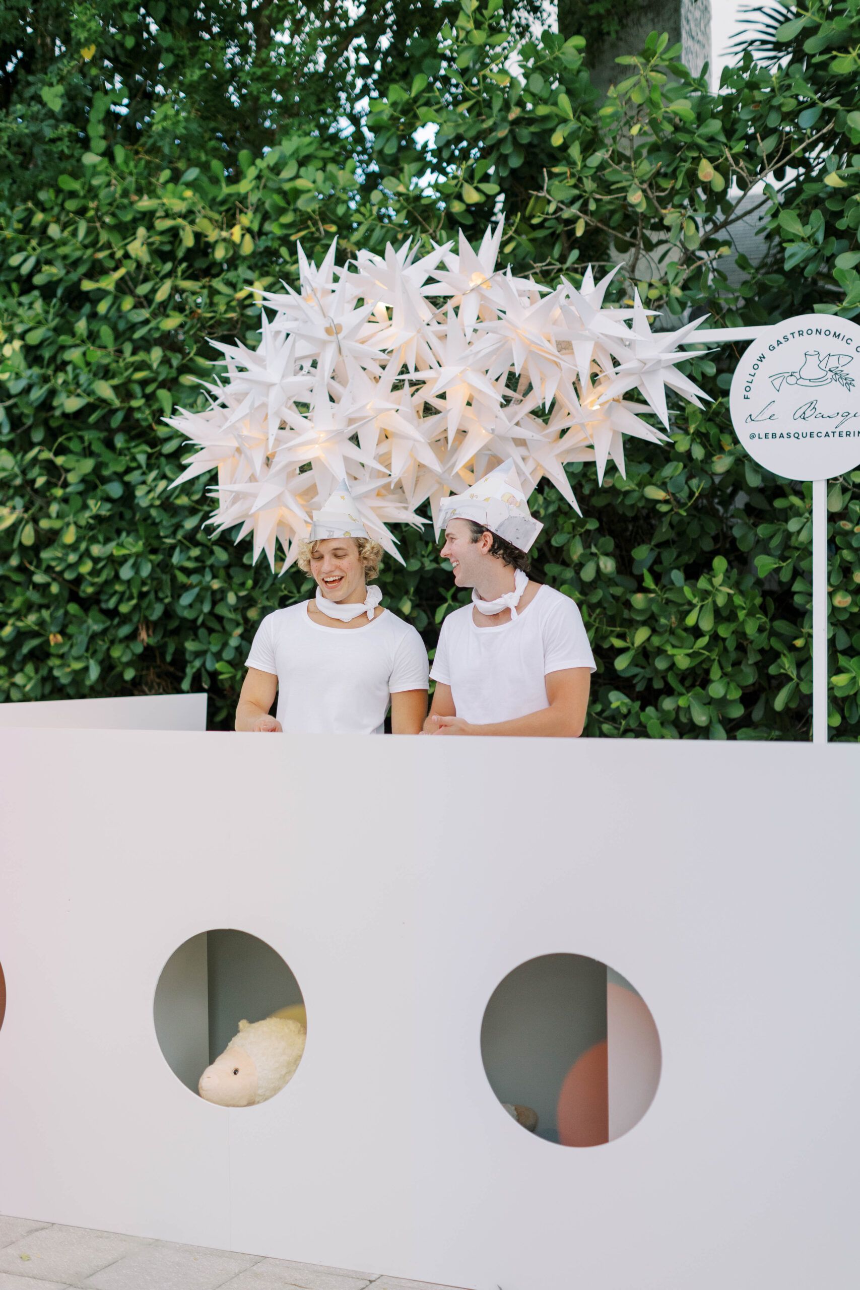 Two people with geometric hats