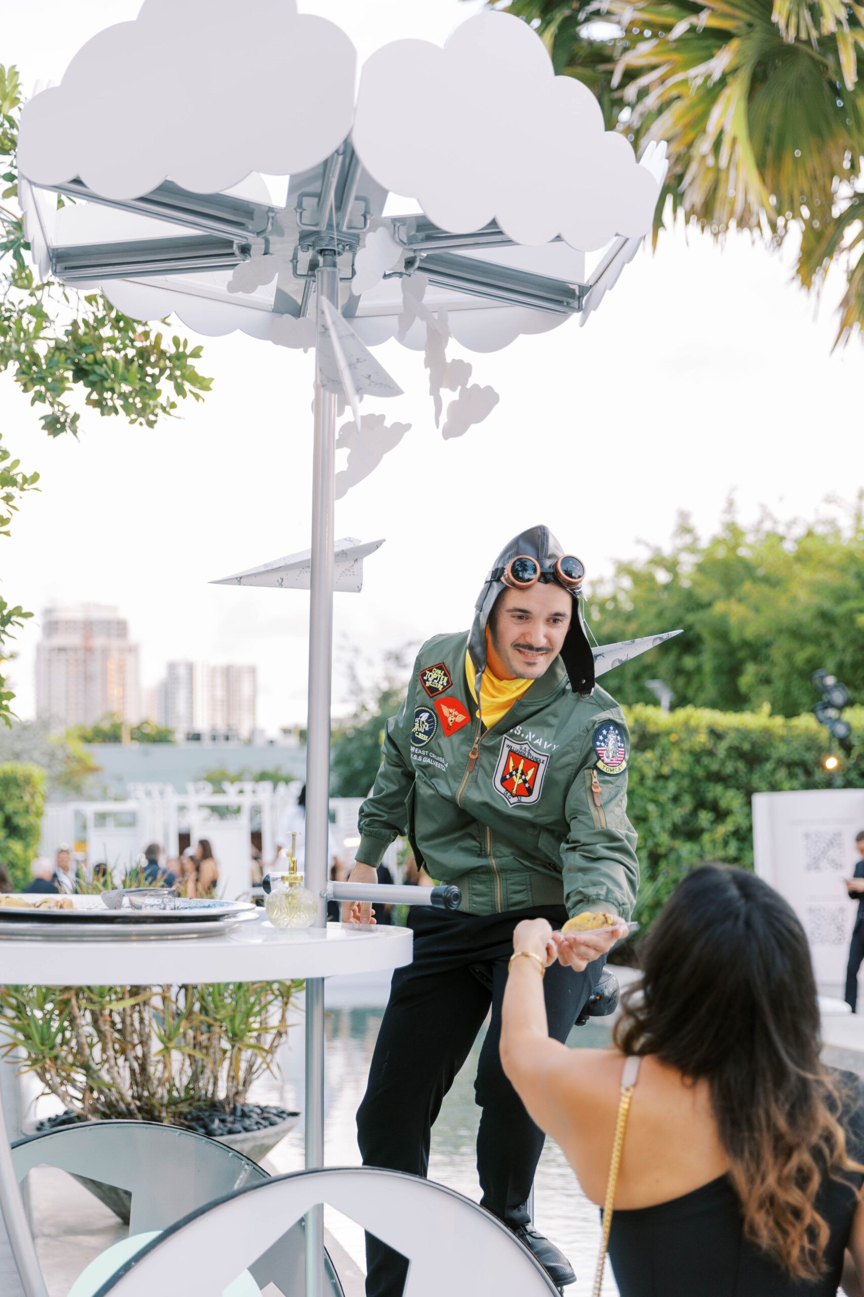 A man passing out tacos