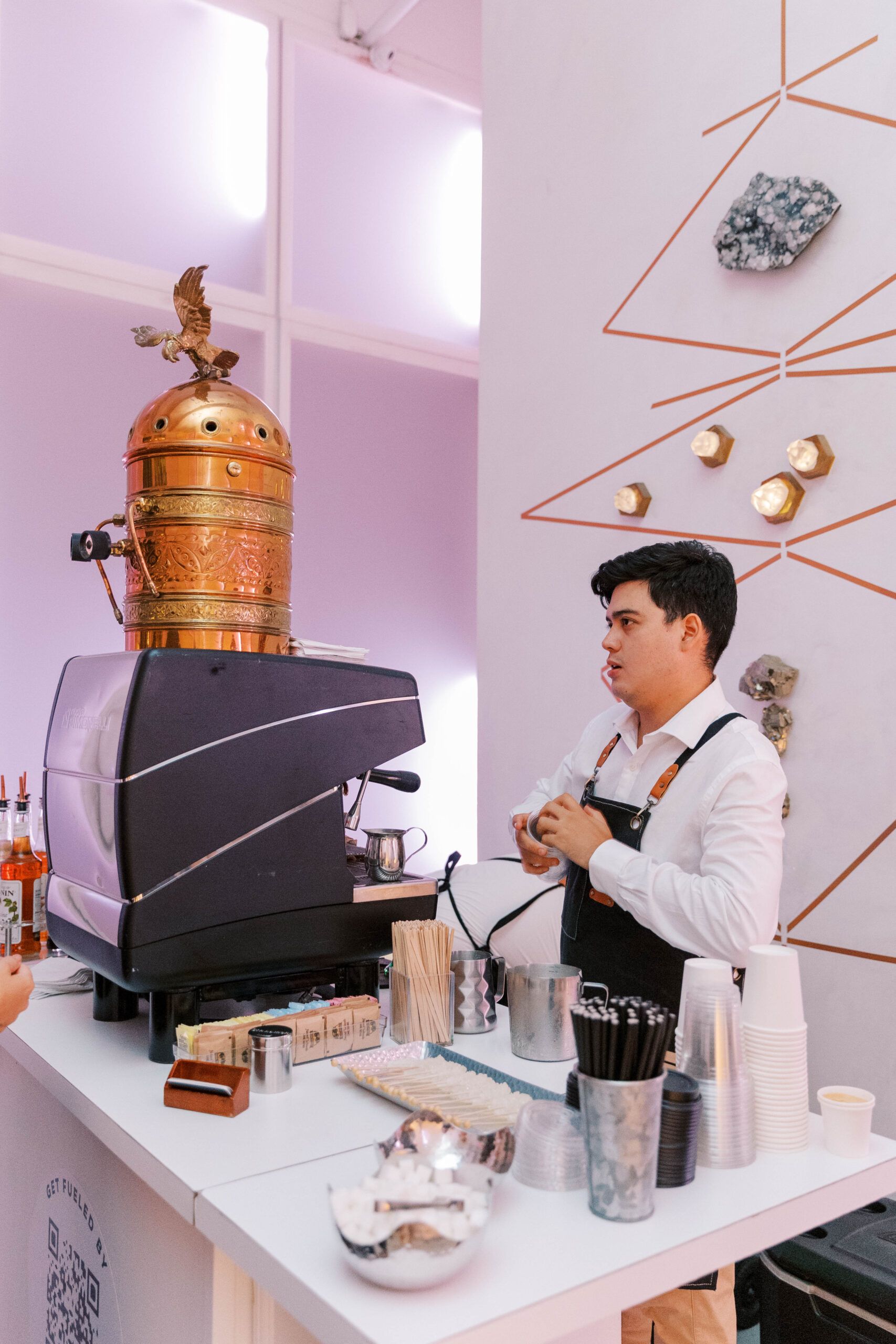 A man working a coffee stand