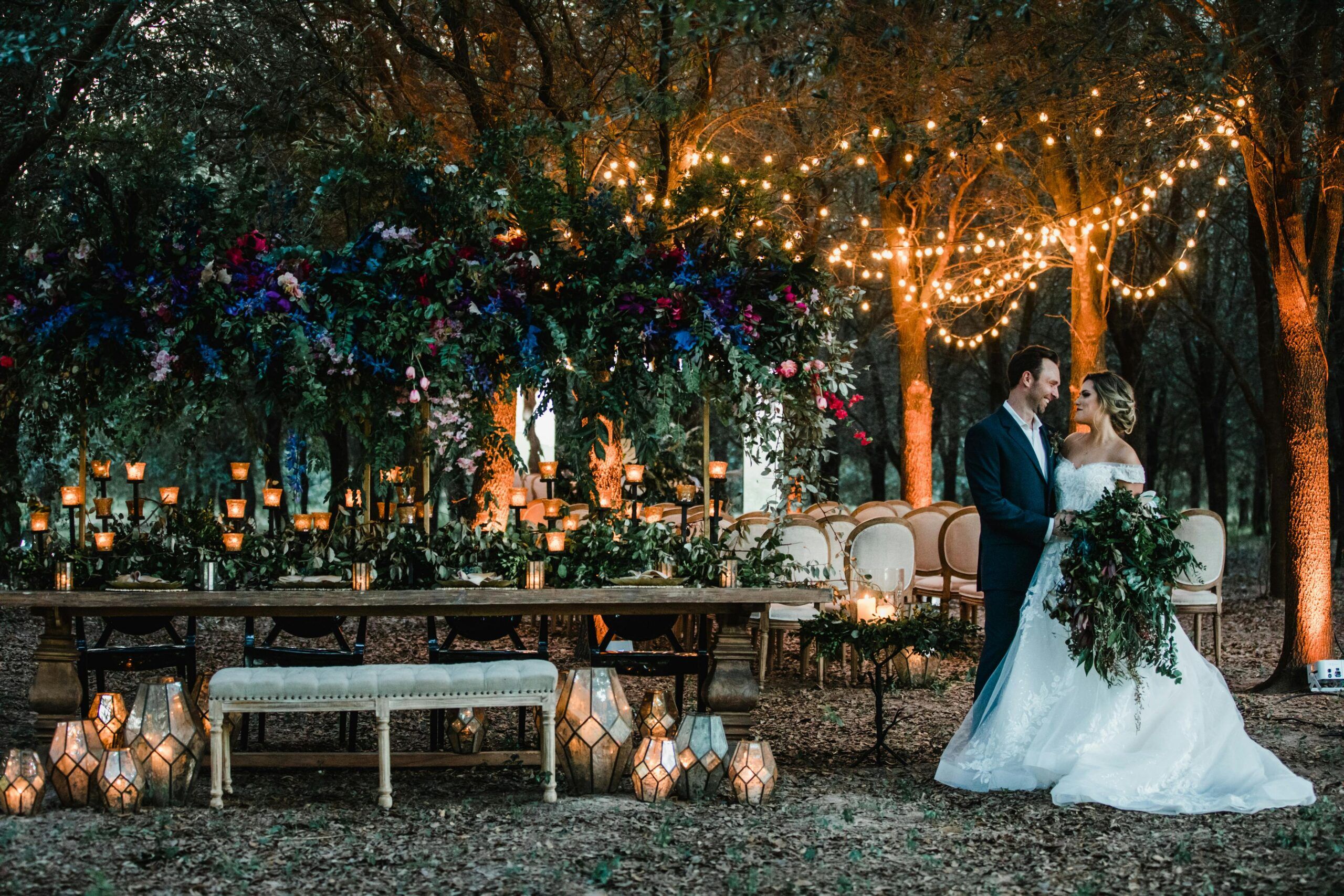 Outdoor wedding reception with twinkling overhead lights at A Thousand Oaks Events & Retreats
