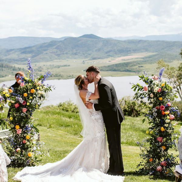 Bright rustic floral wedding ceremony in Colorado.