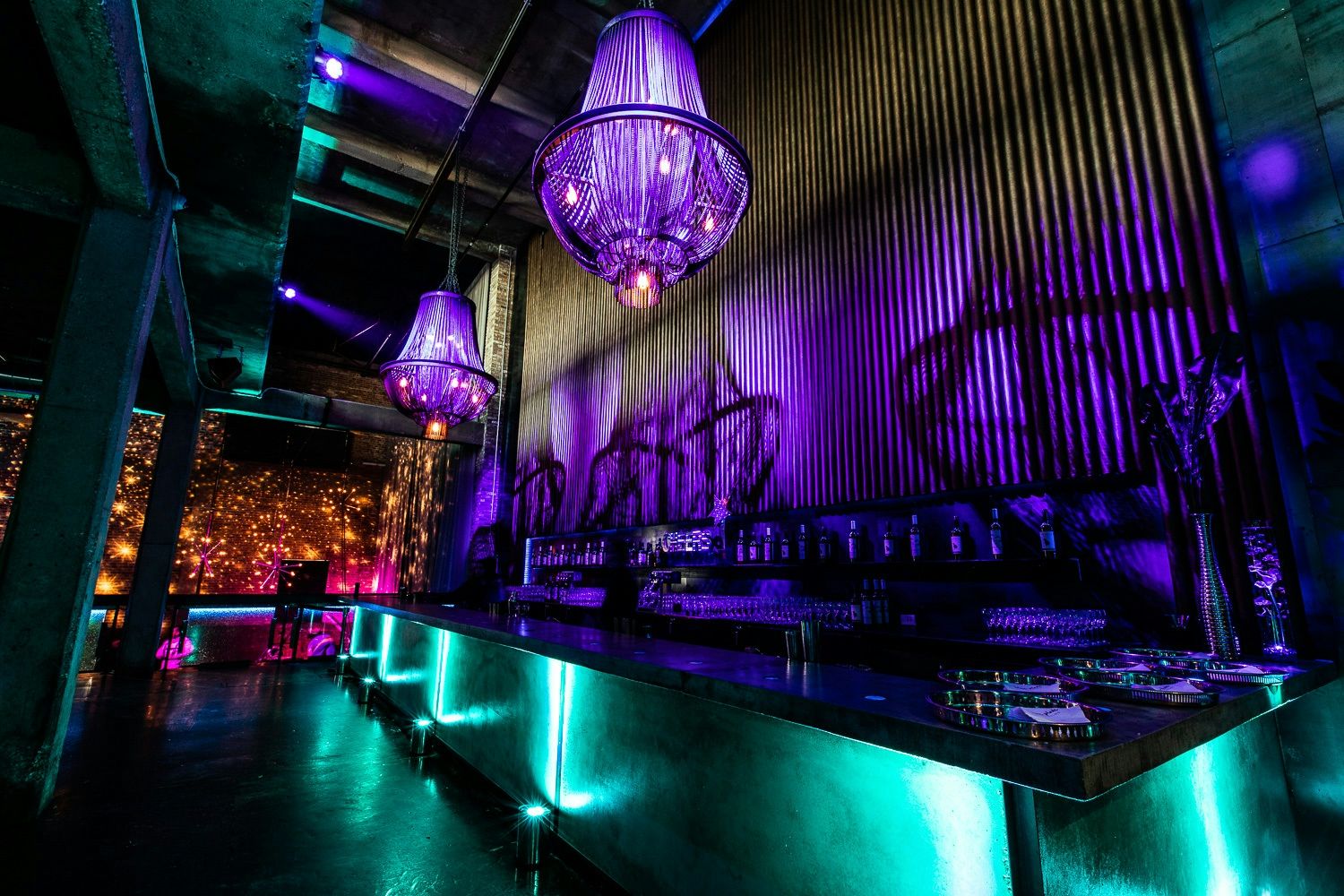 Corporate event with green and purple lighting at Morgan Manufacturing