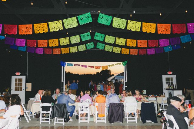 Featured photo from Step Into This Nature-Filled Wedding Featuring Colorful Papel Picado and Rustic Charm at YMCA Camp St. Croix