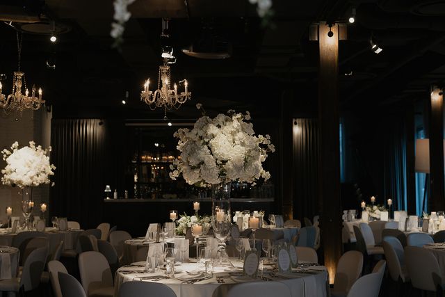 Featured photo from Revel In This Chicago Wedding at a Contemporary Event Space with Hanging Flowers and Glowing Reception Tables