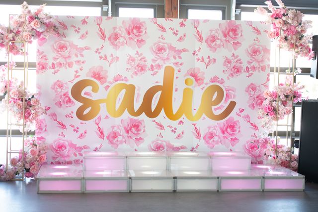 Featured photo from Step Into This Pink-Themed Bat Mitzvah with a Floral Backdrop and Sweet Treat Display at Pinstripes