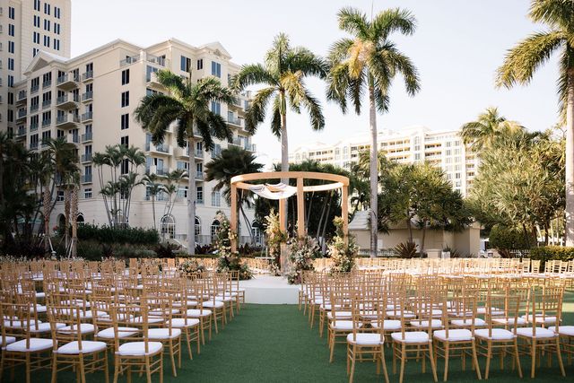 Featured photo from Celebrate This Tropical Wedding in Miami, FL with a White Runway Aisle and Lush Garden-Inspired Design