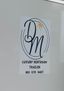 Logo for D & M Luxury Restroom Trailers