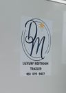 Logo for D & M Luxury Restroom Trailers