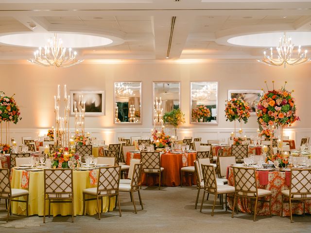 Featured photo from Revel in This Vibrant Wedding at The Club at Ibis with Abundant Rose Centerpieces and Colorful Garden Blooms