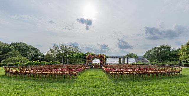 Featured photo from Colorful Summer Tented Wedding at Wave Hill in New York, NY