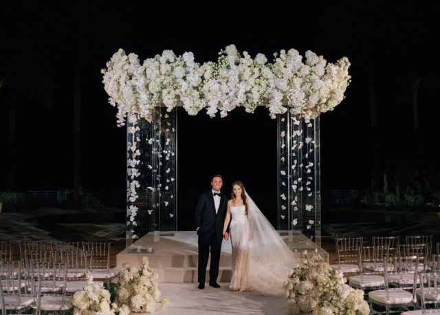 Featured photo from Experience This Oceanfront Wedding at a Luxury Palm Beach Resort Featuring Cascading White Florals