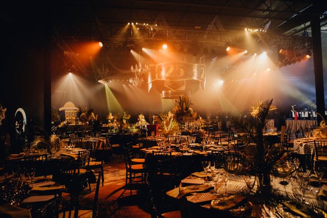Featured photo from Take In This Opulent Holiday Party with Sculptural Centerpieces and a Black-and-Gold Palette at a Philadelphia Arena