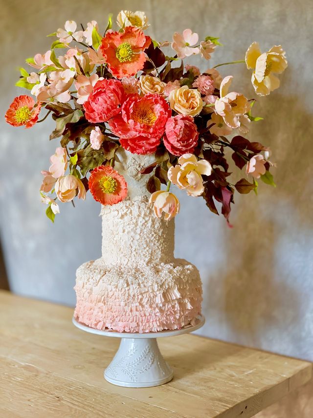 Featured photo from Floral Pink Ombre Cake by Julie Simon Cakes