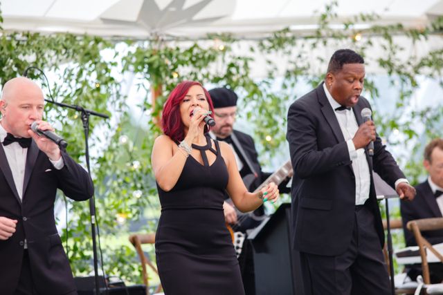 Featured photo from Lively, Tented Wedding in Petoskey, MI