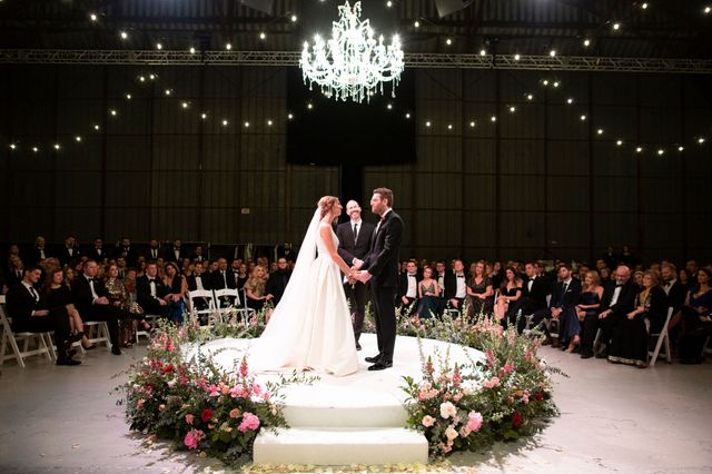 Featured photo from Glamerous New Years Eve wedding in an Airplane Hangar