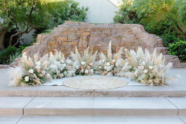 Featured photo from Dajah & Ben's Boho Chic wedding at Dragonridge Country Club