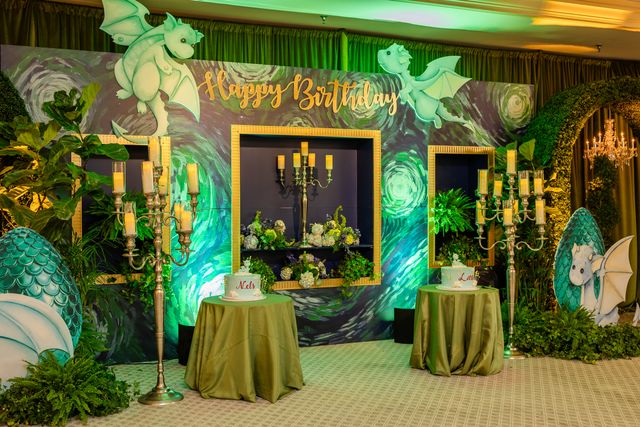 Featured photo from Explore This Storybook Birthday Party Featuring a Dragon Motif and Lush Green Installations at Saddle and Cycle
