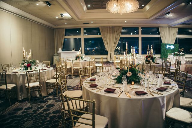 Featured photo from Experience This Bayfront Wedding at Rusty Pelican with a Candlelit Ballroom and Rich Red Rose Décor