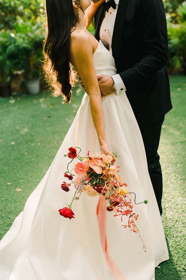 Featured photo from Modern Tropical Wedding with Touches of Red