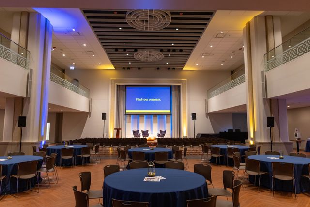 Featured photo from Step Into This Corporate Event in Chicago with Blue Uplighting and a Central Stage for Speaker Panels