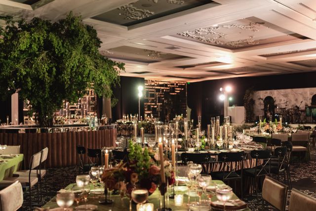Featured photo from A Luxe Coastal Florida Wedding Featuring Lush Greenery Accents and a Dramatic Candlelit Ballroom