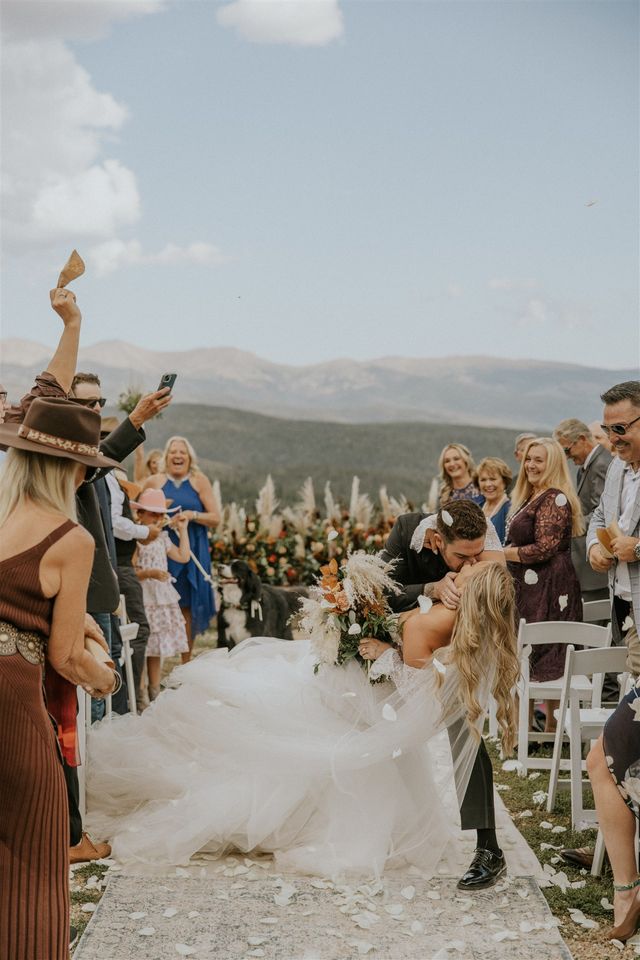 Featured photo from Tara + Shawn Mountain Boho Disco Wedding