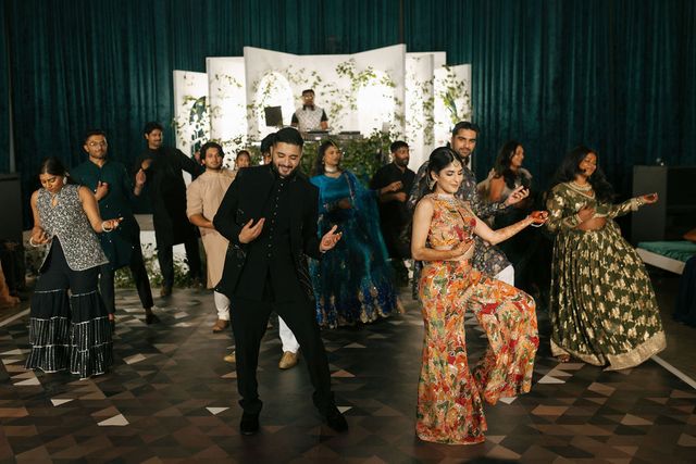Featured photo from Step Into This Sangeet Celebration with a Greenery-Framed Stage and Emerald Velvet Backdrops in Dallas
