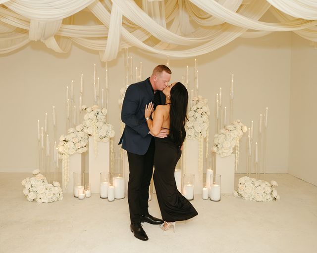 Featured photo from A Modern Candlelit Proposal Drenched in White Florals and Draping