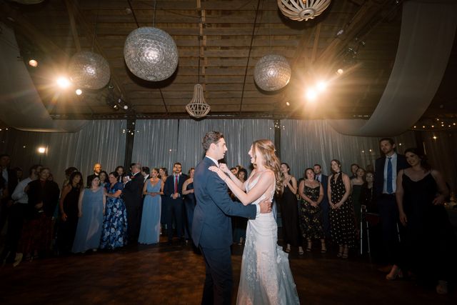 Featured photo from Celebrate This Romantic Chicago Wedding with Moody Lighting and Candid Joy at Rockwell on the River
