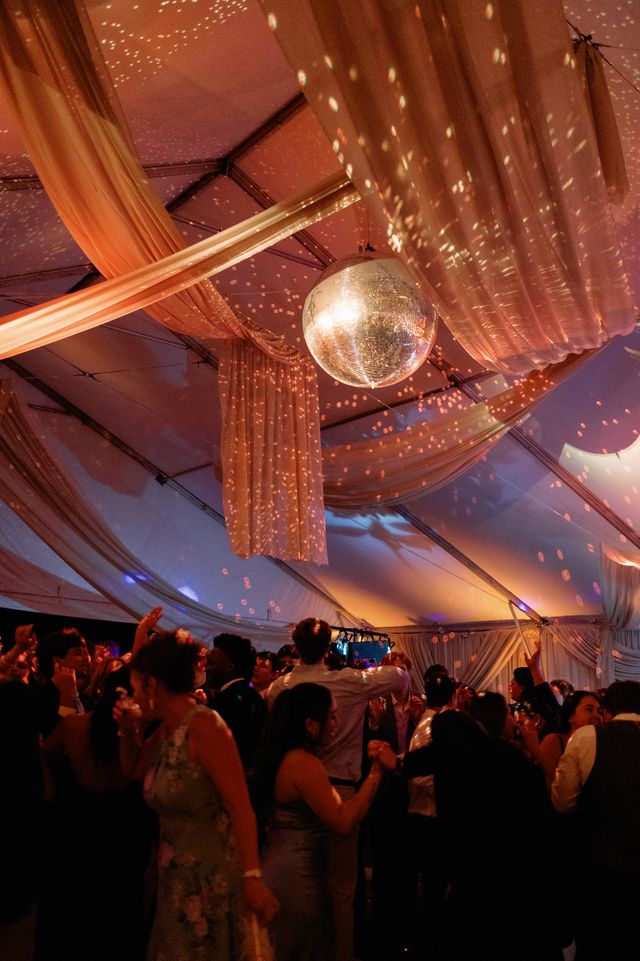 Featured photo from Dreamy Tented Reception with Draped Ceilings and Sparkling Disco Ball Magic