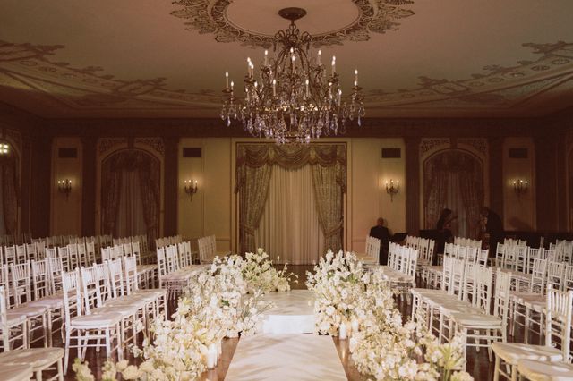 Featured photo from Witness This Wilmington Wedding with Sweeping White Aisle Florals and Historic Ballroom Reception Design