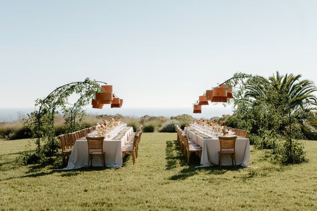 Featured photo from Discover This Romantic Malibu Wedding with Curved Greenery Arches and Coastal Dinner Party Details