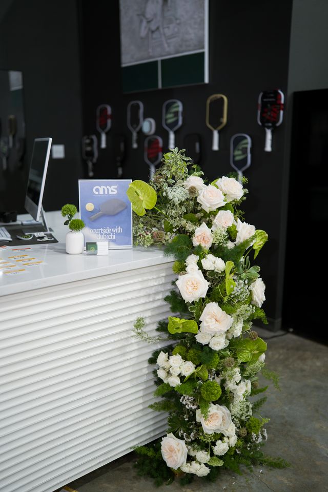 Featured photo from See This Westside Pickleball Club Corporate Event with Organic Greenery Installations and Modern Floral Details