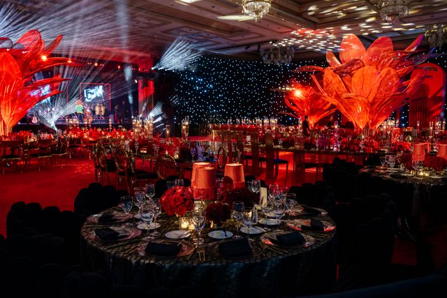 Featured photo from Inside This Crimson-Toned Los Angeles Celebration with Star-Draped Walls and Sculptural Chandelier Forms