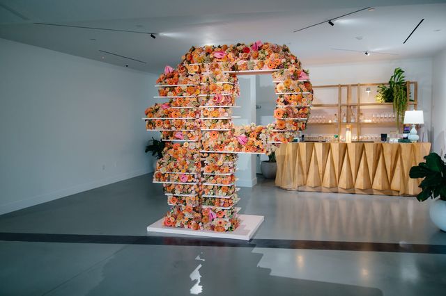 Featured photo from Inside this Warehouse Opening in Florida Illuminated by Lush Florals and Vibrant Light