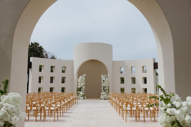 Featured photo from A Minimalist Wedding in Cabo San Lucas Featuring Arched Ceremony Design and Palm-Framed Reception