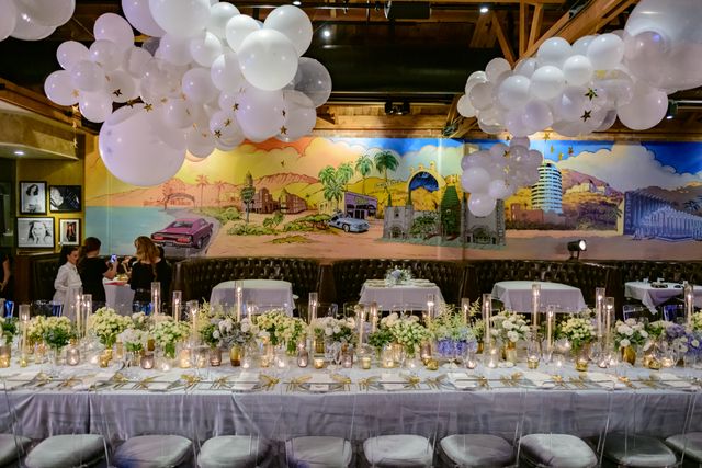 Featured photo from Explore This Dreamy Baby Shower with Floating Balloons, Gold Accents, and Floral-Lined Tables