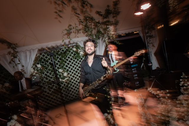 Featured photo from A Topsfield Wedding Elevated by Electric Performances and a Canopy of Hanging Florals