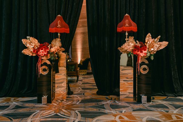 Featured photo from A Casino Night Featuring Dramatic Draping and Bold Red Floral Statements at Hotel Intercontinental Miami