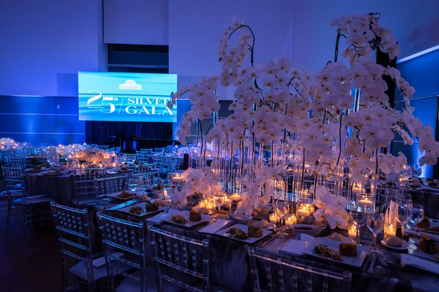 Featured photo from See This Silver Anniversary Gala Framed by Floating Florals and Glowing Tables at Norton Museum of Art