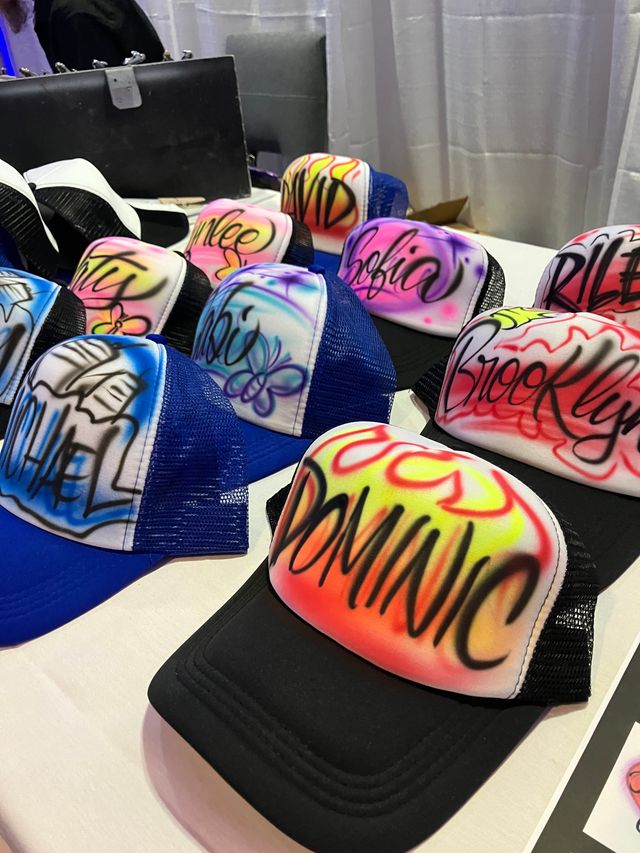 Featured photo from Florida Airbrush customized hats and drawstring bags for party